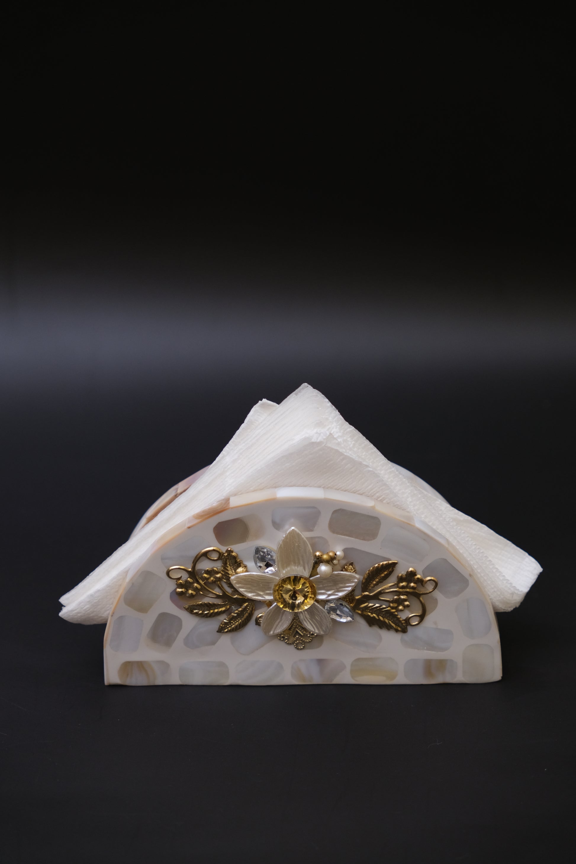 Handcrafted mother of pearl napkin holder with gold floral inlay and white napkins