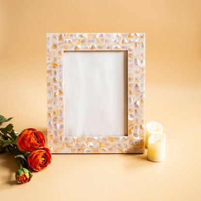 Mother of pearl photo frame with mosaic pattern, styled with flowers and candles