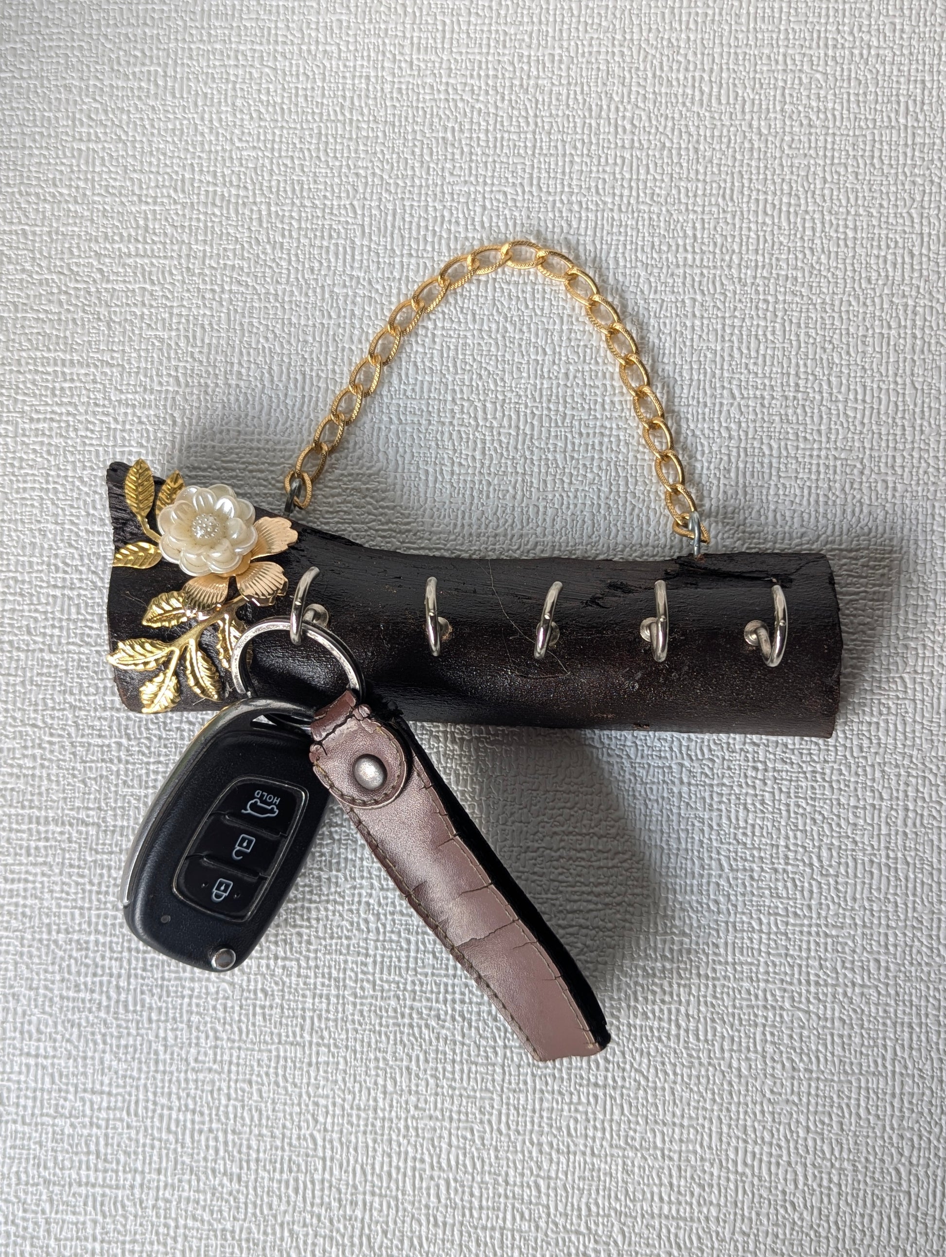 Handcrafted wooden wall key holder with mother of pearl floral inlay and gold chain