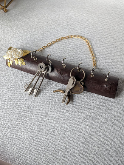 Handcrafted wooden key holder with gold chain and floral Mother of Pearl accents