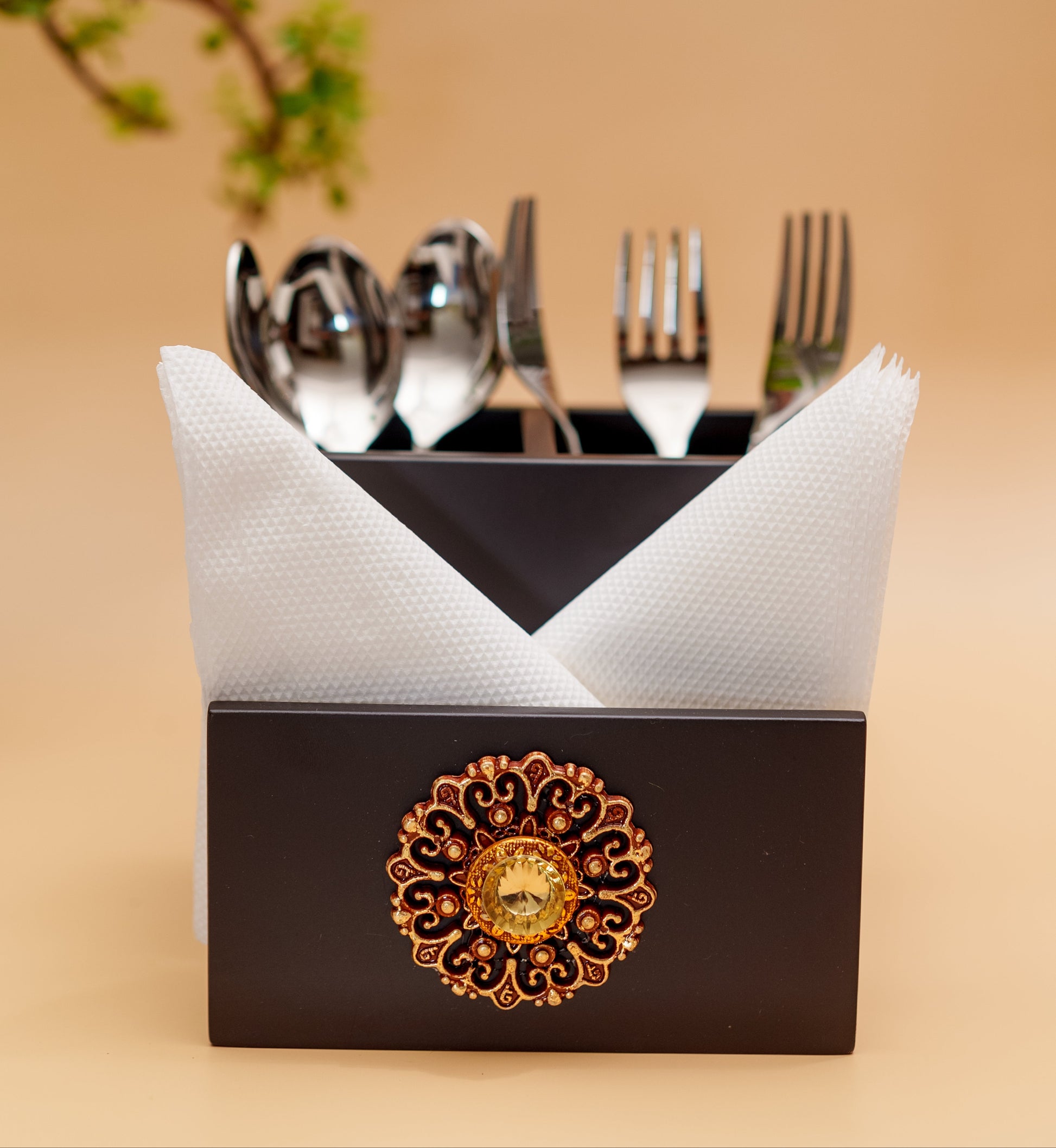 Handcrafted black wooden cutlery holder with ornate gold floral design, napkins and utensils