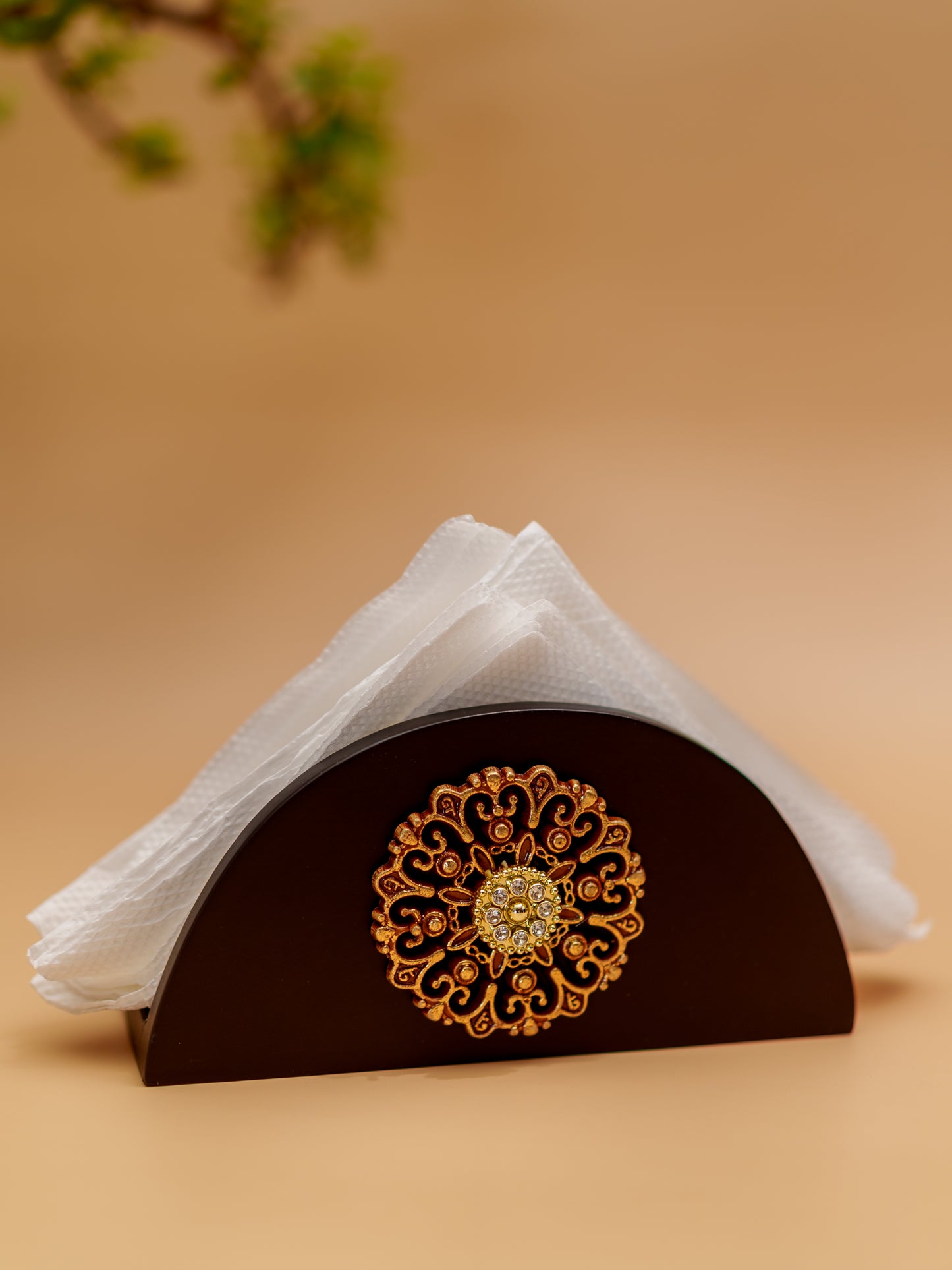 Handcrafted wooden napkin holder with gold floral motif and decorative accents