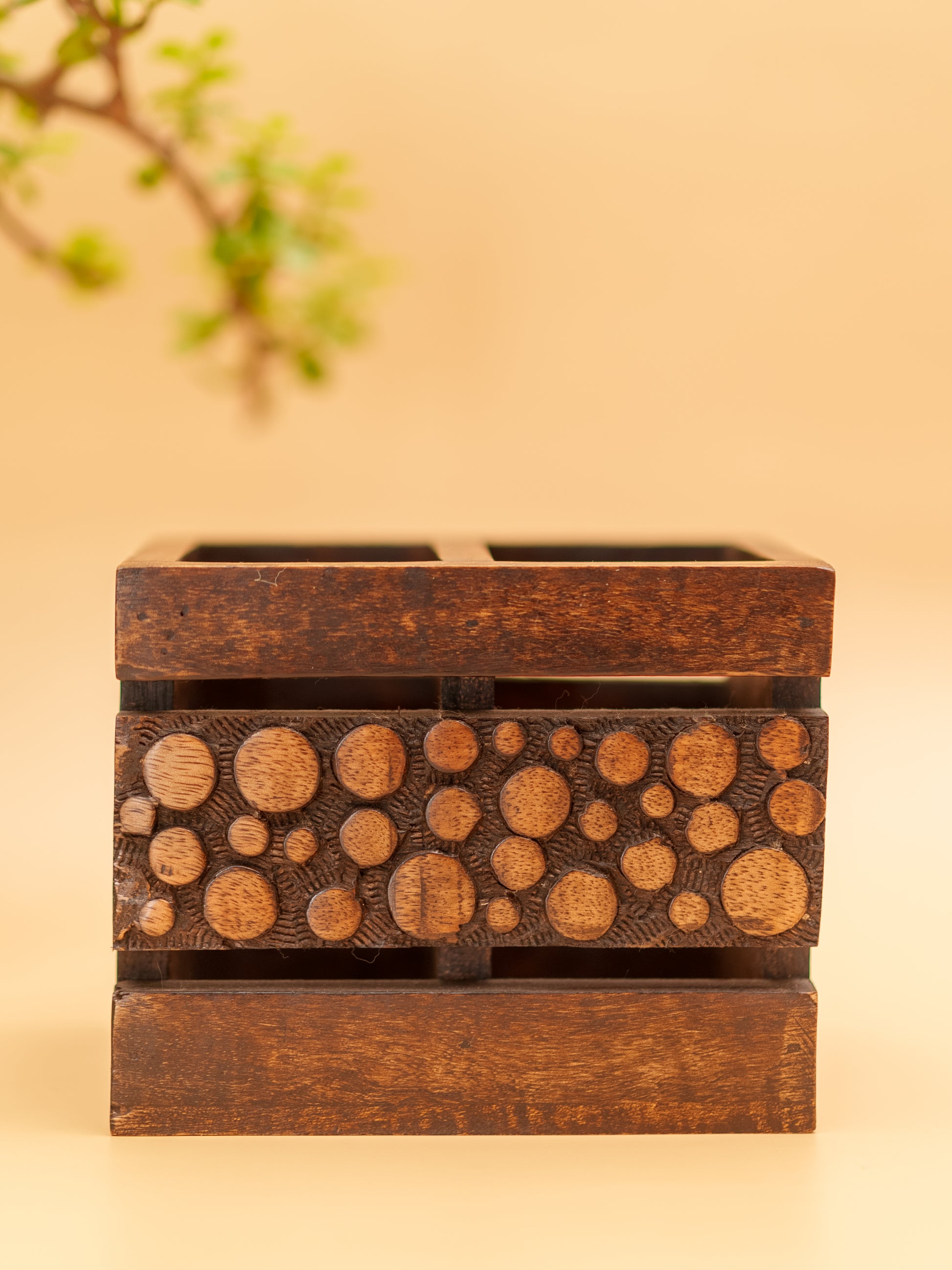 Handcrafted wooden pen holder with carved circular patterns, Indian home decor